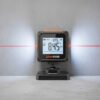 Digital Inclinometer - Laser Angle Measurement Digital inclinometer with red laser line measuring angle on wall and floor surface