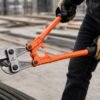 Heavy Duty Bolt Cutter Cutting Steel Wire Cable Worker using 24-inch heavy duty bolt cutter to cut steel wire cable on construction site