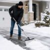 Heavy-Duty Scraper Shovel for Ice & Snow Person using heavy-duty steel scraper shovel to clear ice and snow from driveway
